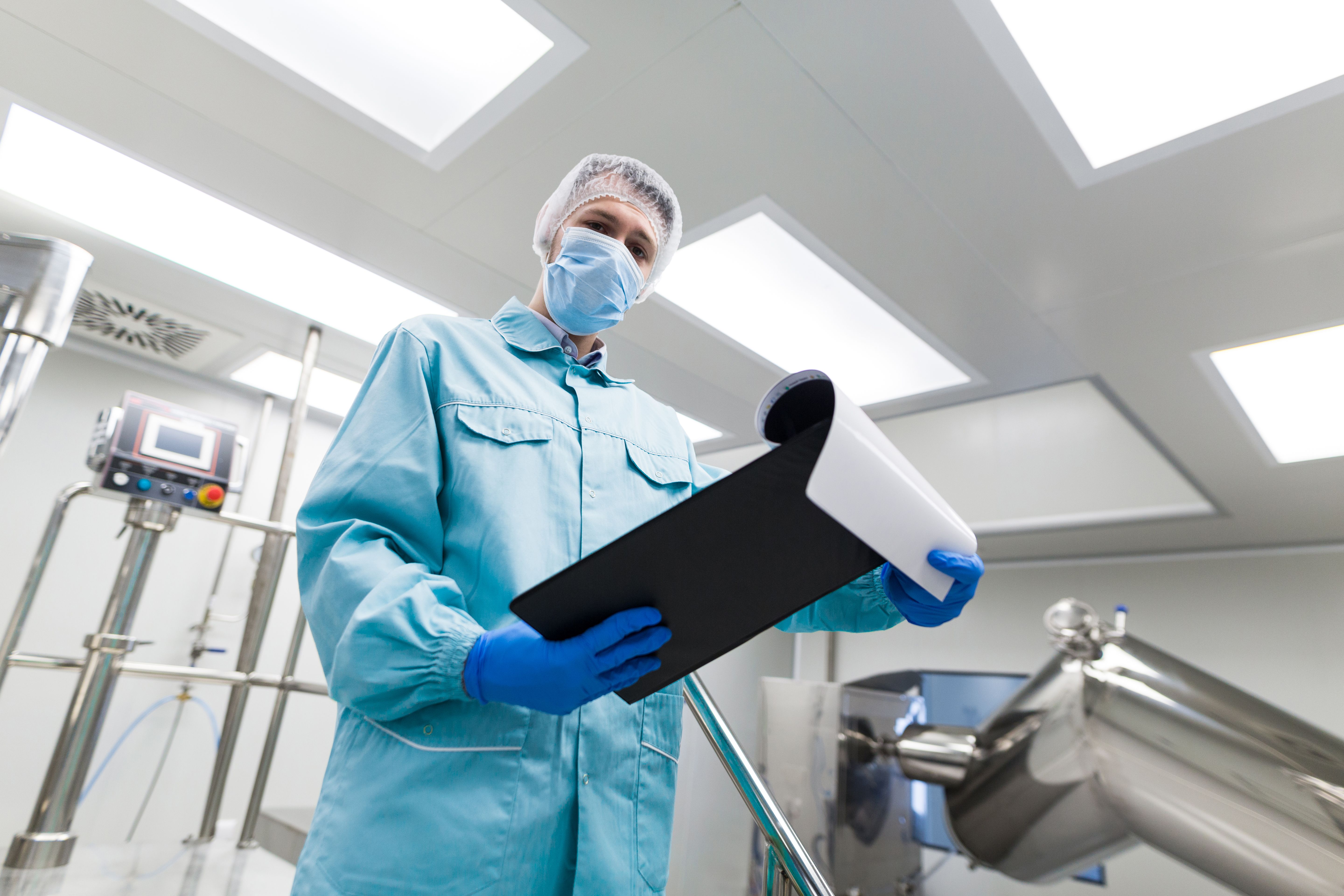 close-look-scientist-blue-lab-suit-stand-metal-chromed-stairs-laboratory-look-tablet-from-bellow