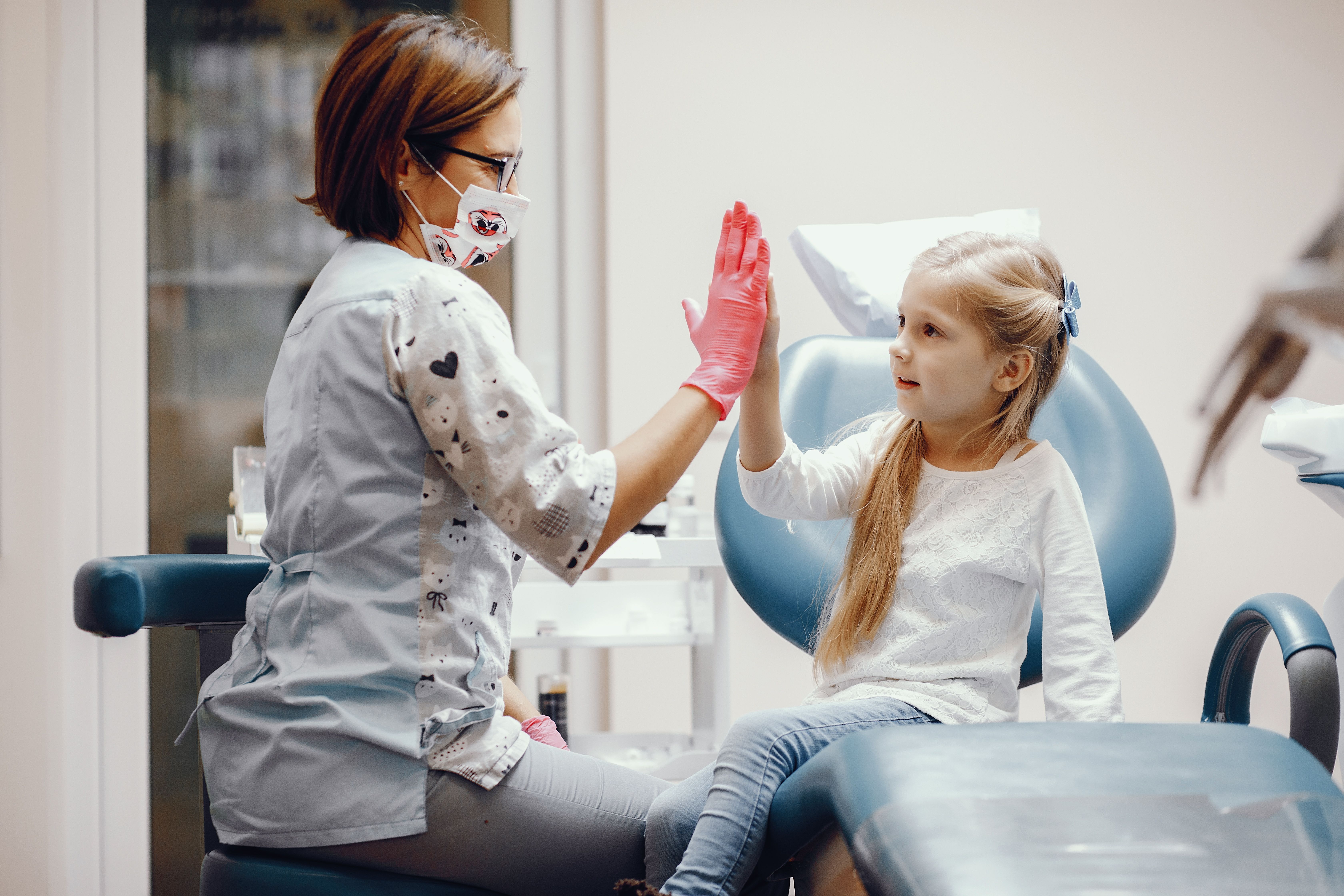 cute-little-girl-sitting-dentist-s-office