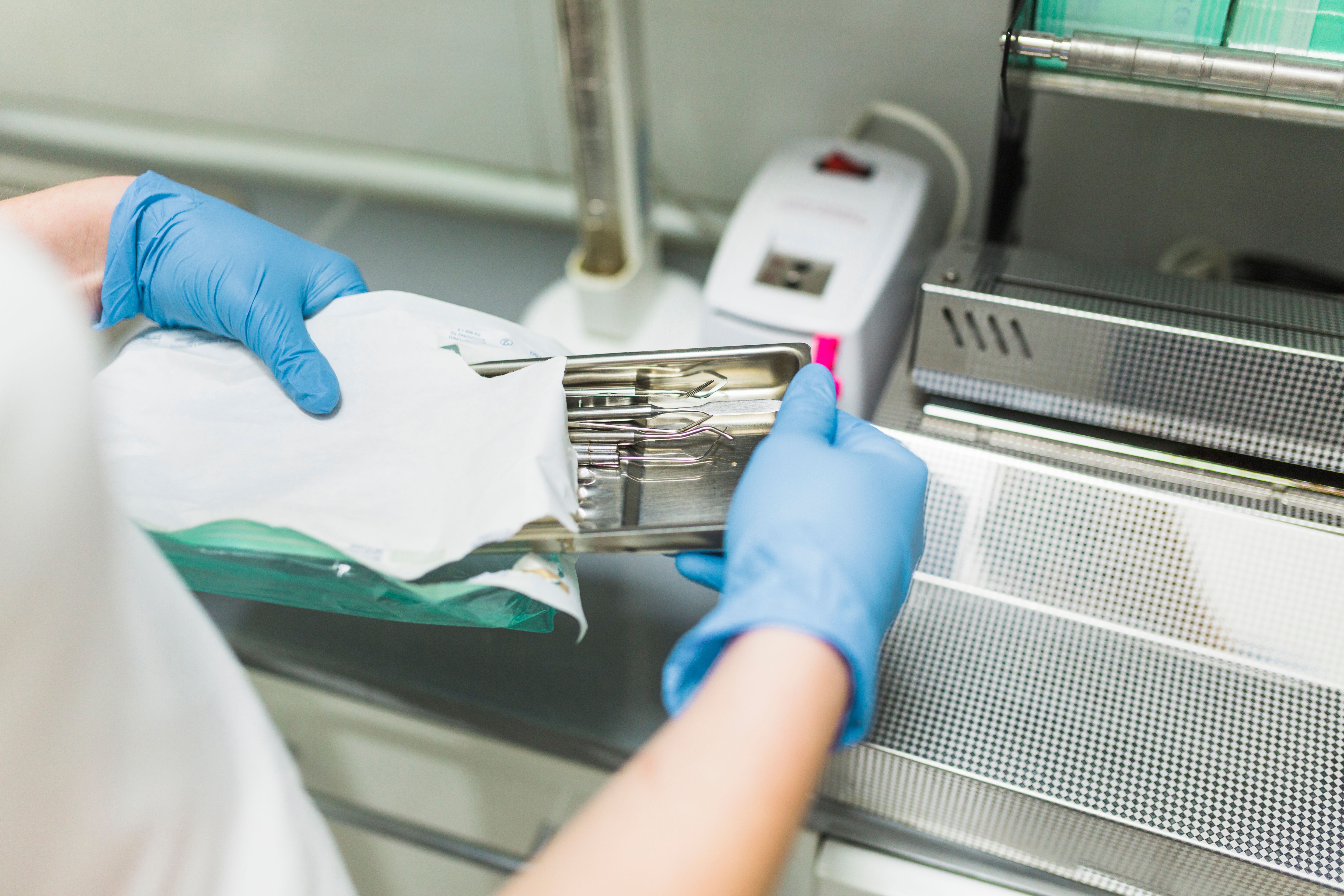 nurse-hand-packing-dental-instrument-plastic-bag