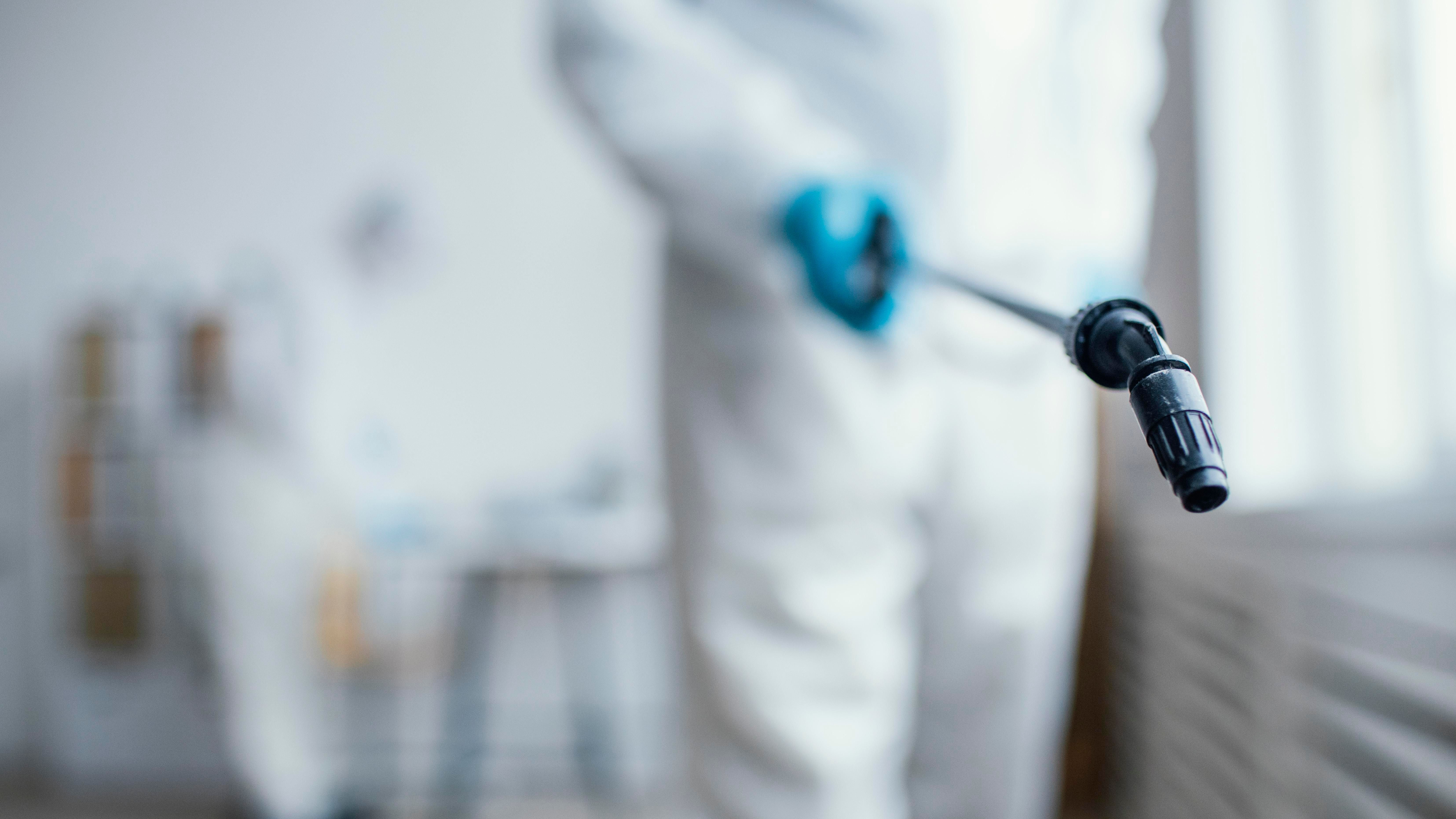 people-disinfecting-biohazard-area