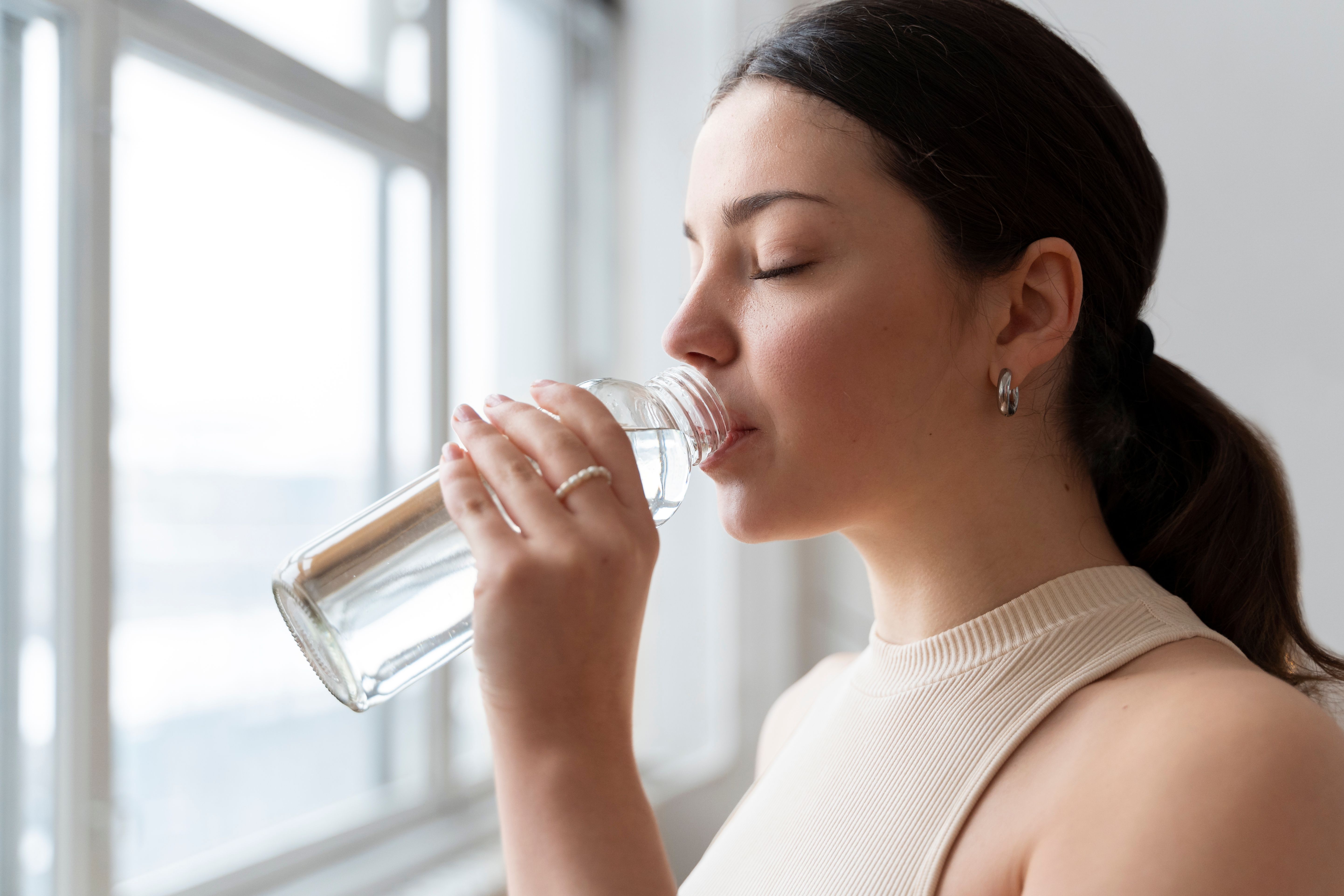 woman-drinking-water-after-exercise.jpg